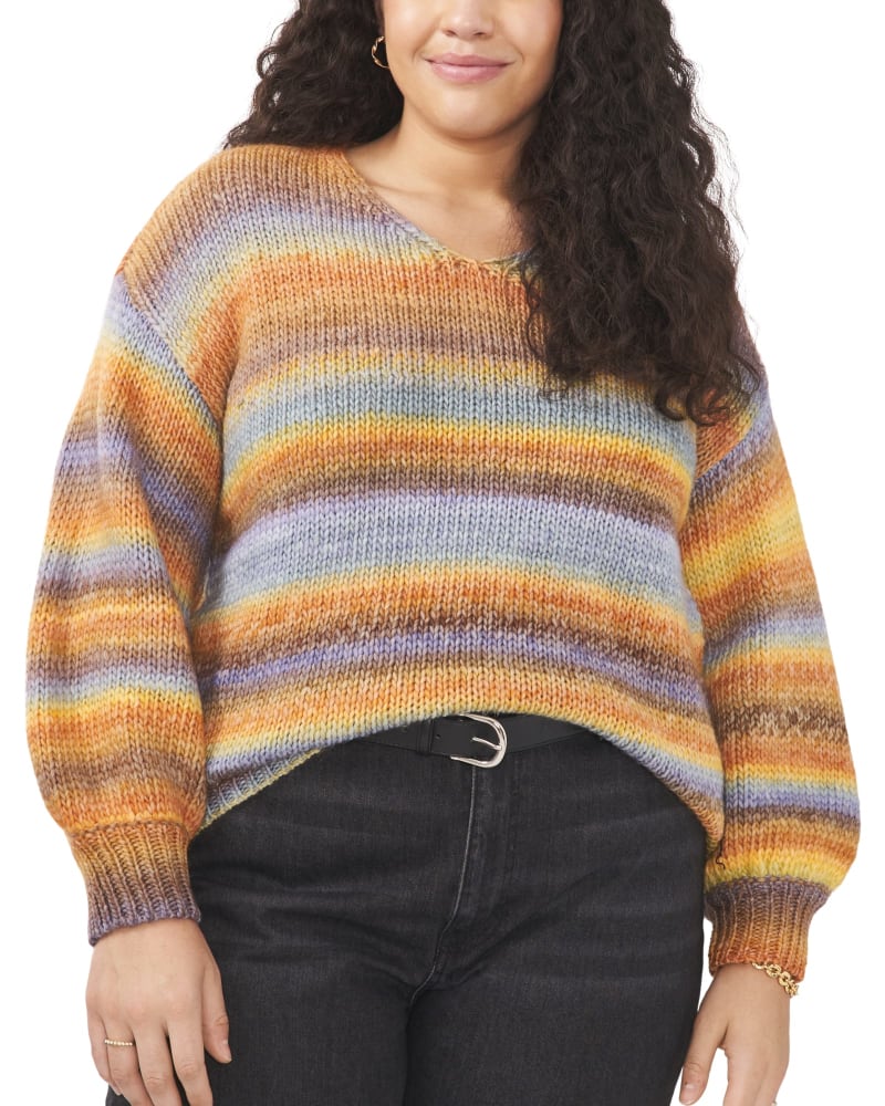 Front of a model wearing a size 1X Maddie Roving Sweater in Citrus Spice by Vince Camuto. | dia_product_style_image_id:260888